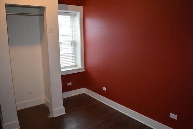 unfurnished bedroom featuring dark hardwood / wood-style floors