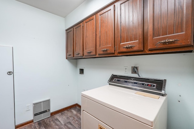 laundry area with cabinets, washer / dryer, and dark hardwood / wood-style floors