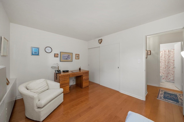 sitting room with light wood-type flooring