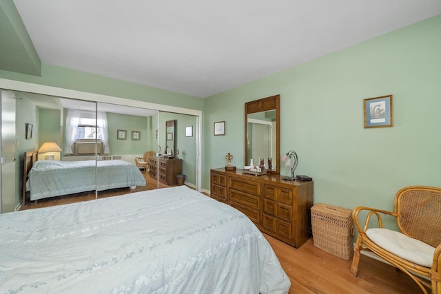 bedroom featuring a closet and light hardwood / wood-style flooring