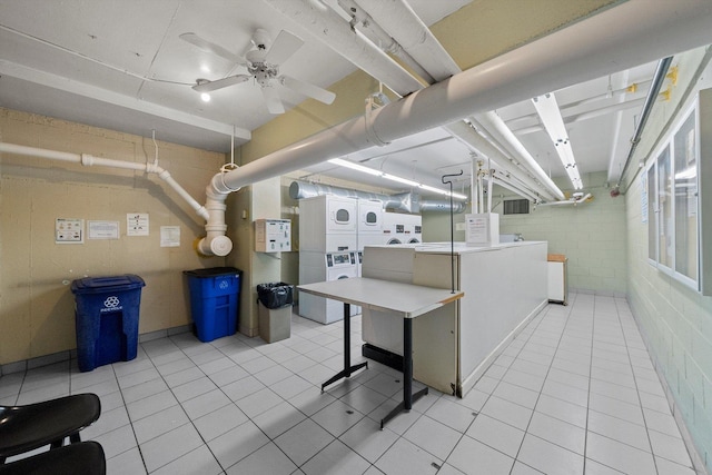 laundry area featuring ceiling fan, light tile patterned floors, washer and dryer, and stacked washer and clothes dryer