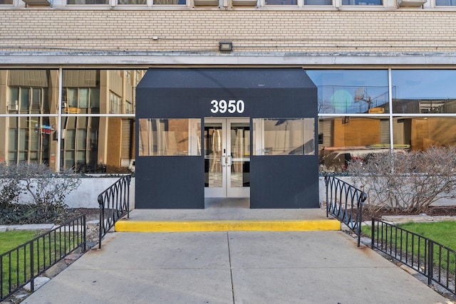 view of exterior entry featuring french doors