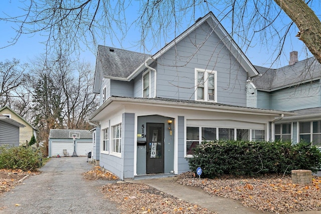 view of front facade with an outdoor structure and a garage