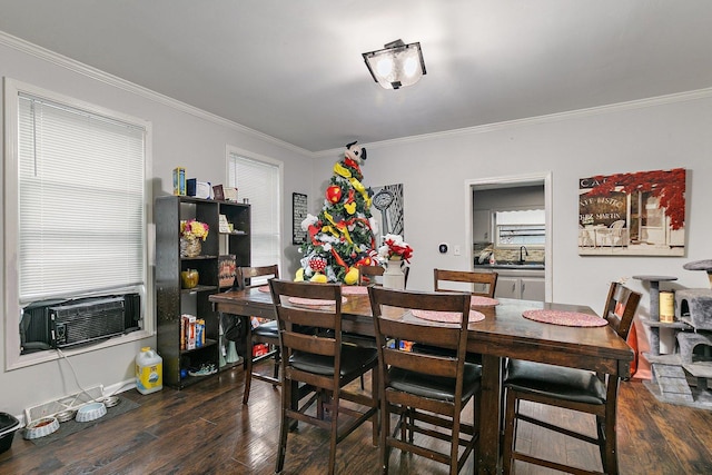 dining area with dark hardwood / wood-style floors, cooling unit, ornamental molding, and sink