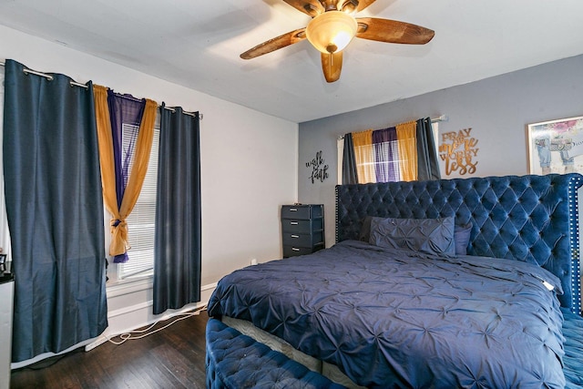 bedroom with ceiling fan and dark hardwood / wood-style flooring