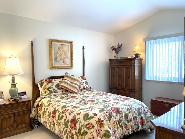 bedroom with lofted ceiling