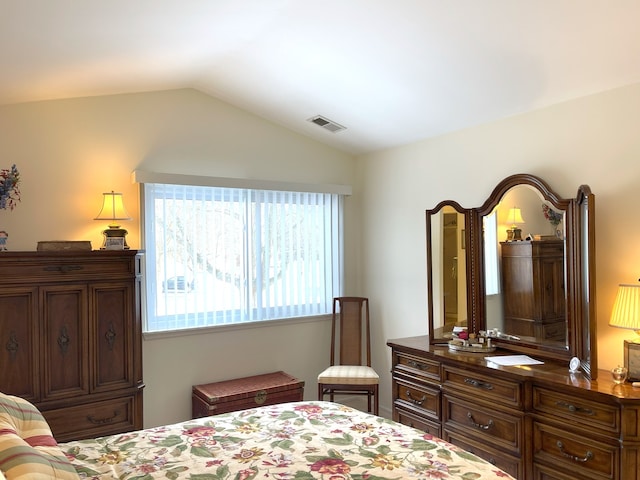 bedroom with lofted ceiling