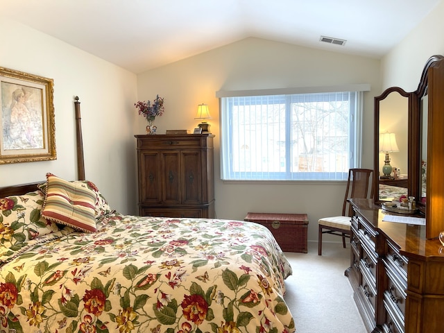 bedroom featuring light carpet and vaulted ceiling