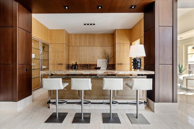 kitchen featuring a kitchen breakfast bar and wood ceiling