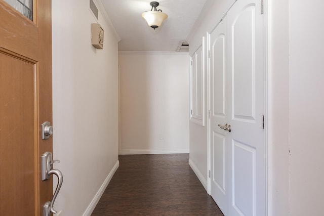 hall featuring crown molding and dark wood-type flooring