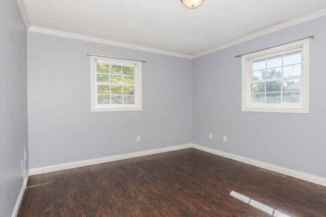 unfurnished room featuring dark hardwood / wood-style floors and ornamental molding