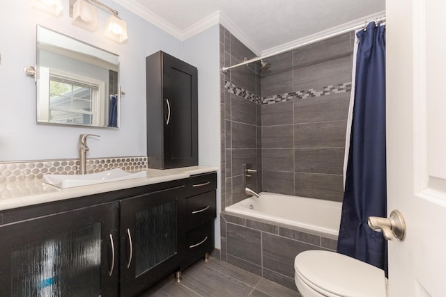 full bathroom with shower / bath combo, tile patterned floors, crown molding, toilet, and vanity