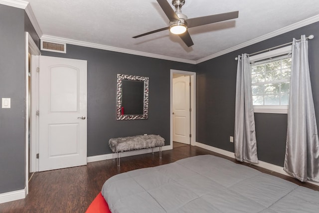 bedroom with ceiling fan, crown molding, dark wood-type flooring, and a textured ceiling