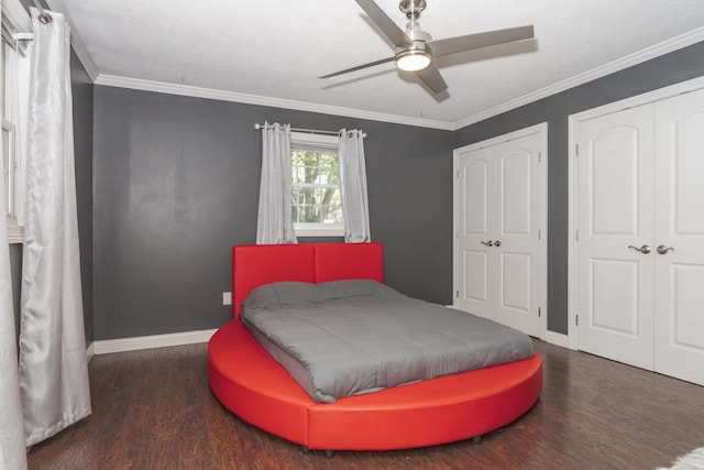 bedroom with ceiling fan, dark hardwood / wood-style floors, and crown molding