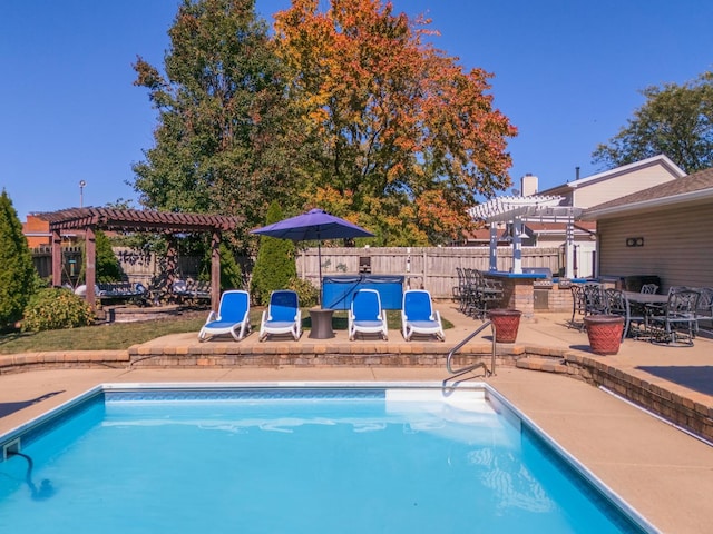 view of pool featuring a pergola and a patio