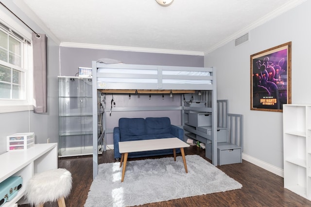 bedroom featuring dark hardwood / wood-style floors and ornamental molding