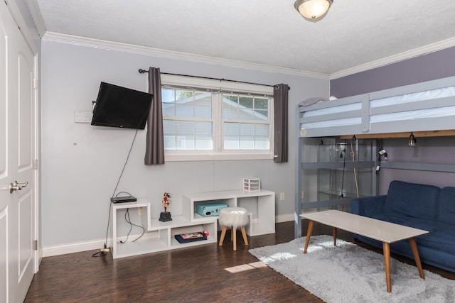 bedroom with crown molding, dark hardwood / wood-style flooring, and a textured ceiling