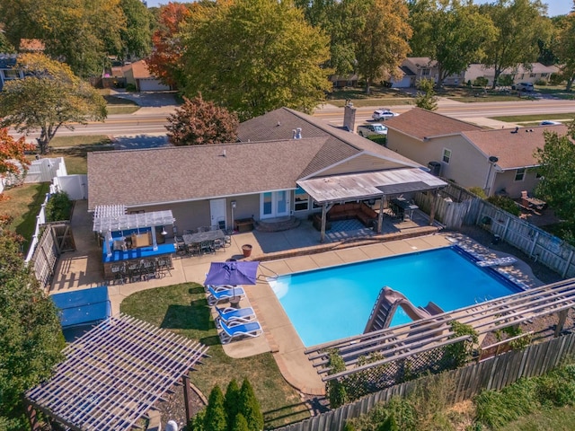 view of swimming pool with a patio