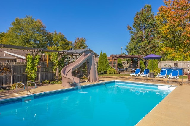 view of swimming pool with a water slide