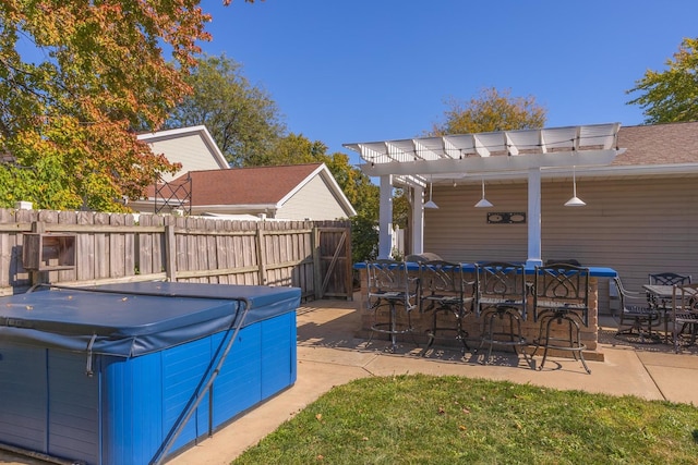 view of pool featuring a patio area, exterior bar, and a hot tub