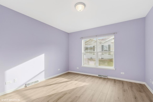 unfurnished room featuring light wood-type flooring