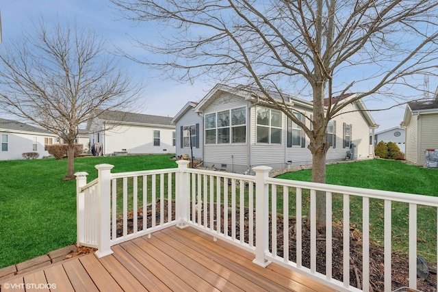 wooden deck with a lawn