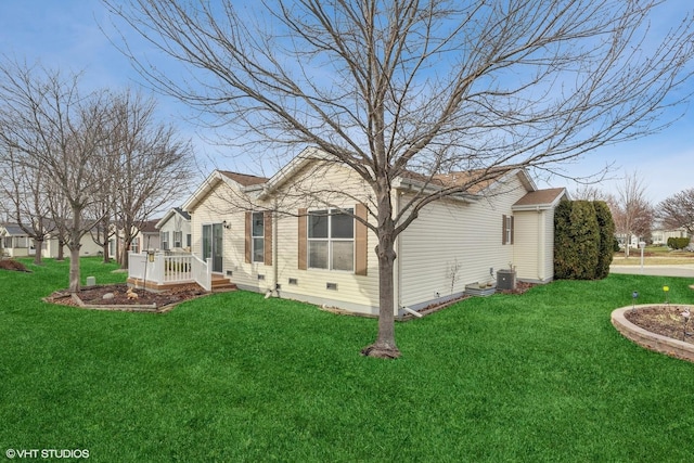 view of property exterior featuring a yard and cooling unit