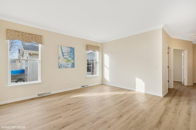 unfurnished room featuring light hardwood / wood-style flooring and ornamental molding