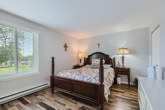 bedroom featuring dark hardwood / wood-style floors and baseboard heating