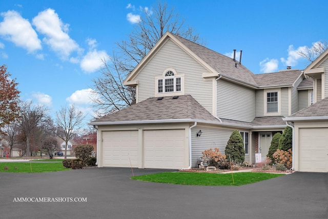 front of property with a garage