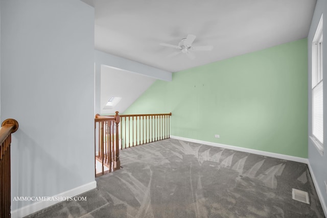 bonus room with carpet, ceiling fan, and lofted ceiling with skylight