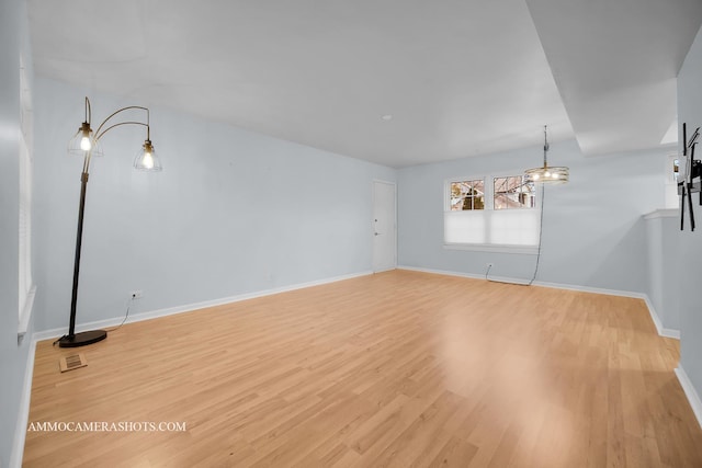 unfurnished room featuring wood-type flooring