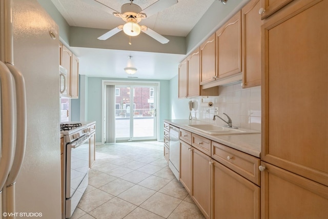 7041 W Touhy Ave Unit 209, Niles, IL 60714 - kitchen featuring white appliances, a sink, light countertops, light brown cabinetry, and ceiling fan