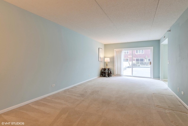 7041 W Touhy Ave Unit 209, Niles, IL 60714 - unfurnished room with carpet and baseboards
