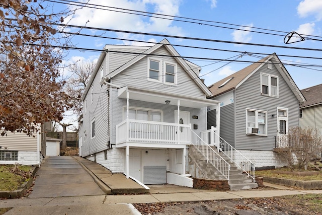 front of property with covered porch and a garage