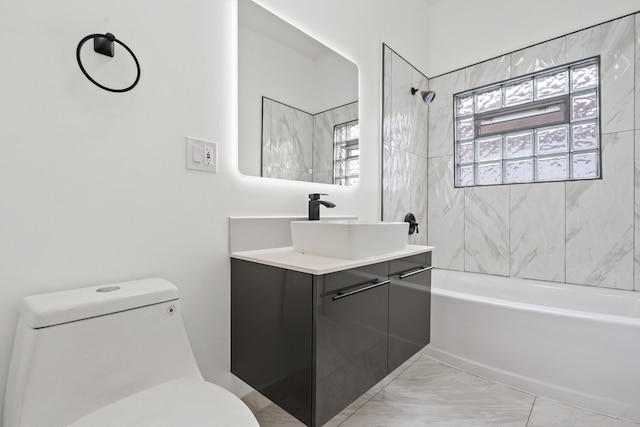 full bathroom with vanity, toilet, and tiled shower / bath