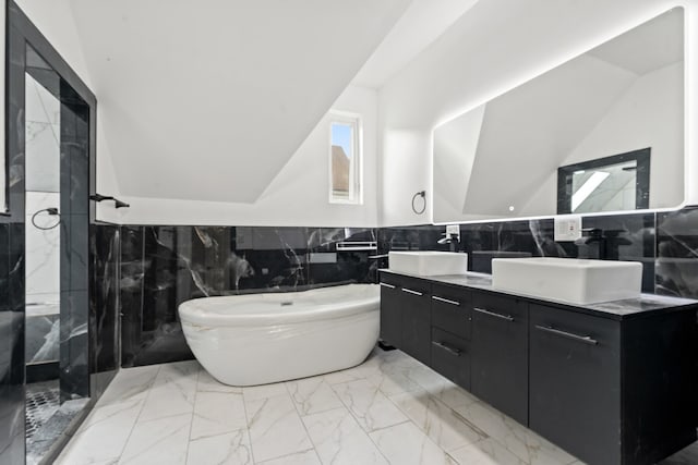 bathroom featuring vanity and tile walls