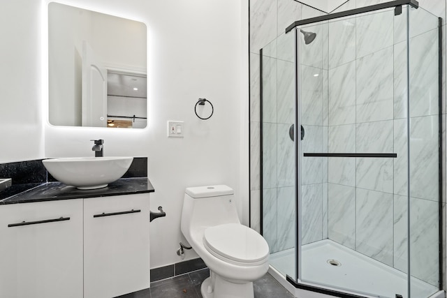 bathroom featuring walk in shower, tile patterned flooring, vanity, and toilet