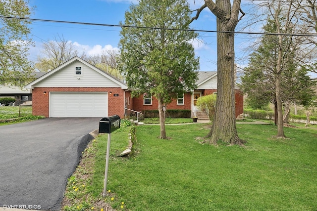 ranch-style home with a garage and a front lawn