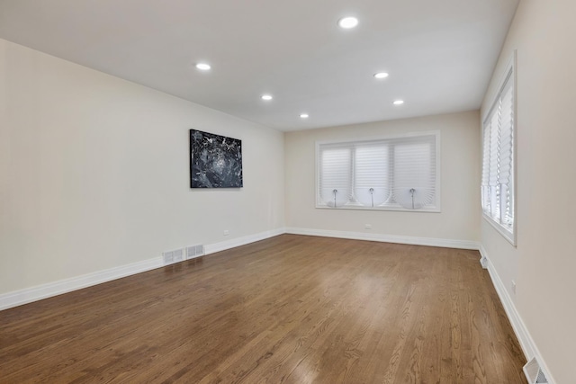 spare room featuring hardwood / wood-style floors