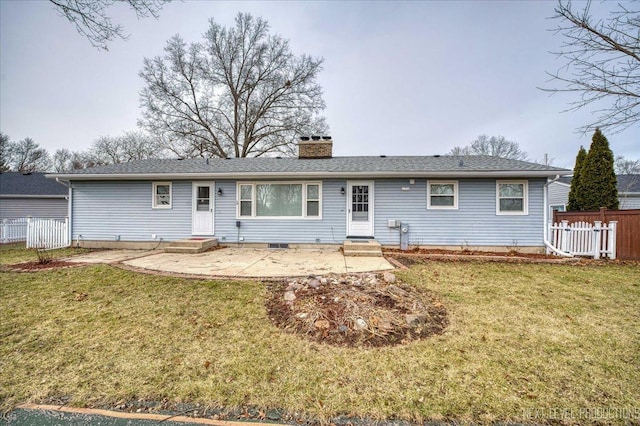 rear view of house with a lawn