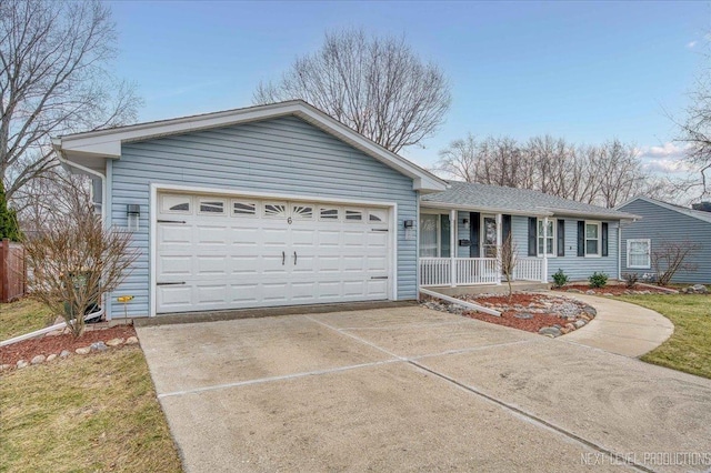 single story home featuring covered porch and a garage