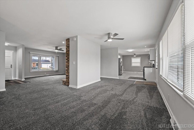 unfurnished living room featuring carpet floors and ceiling fan