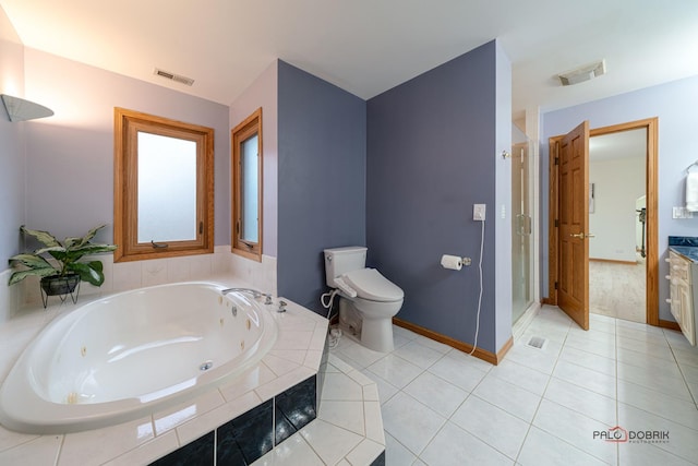 full bathroom featuring tile patterned flooring, vanity, shower with separate bathtub, and toilet