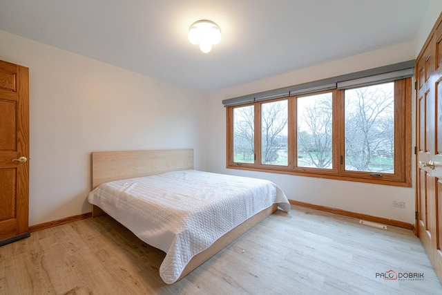 bedroom with light hardwood / wood-style floors