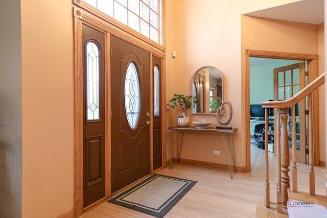 entrance foyer with light hardwood / wood-style flooring