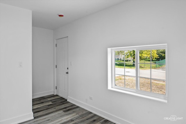 spare room featuring dark hardwood / wood-style floors