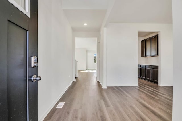 hallway with light wood-type flooring