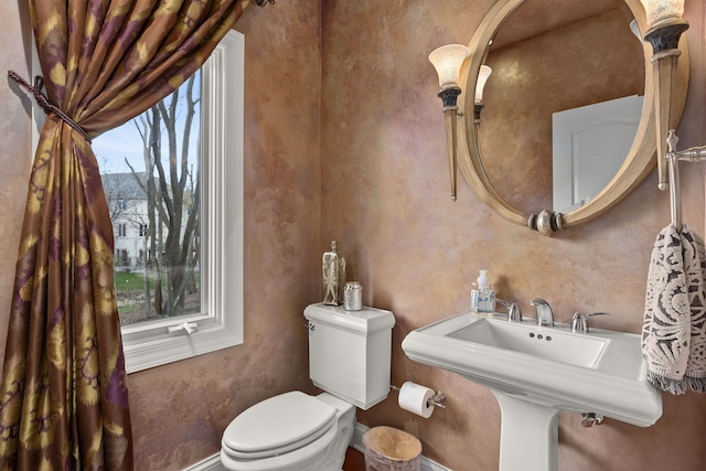 bathroom with sink and toilet