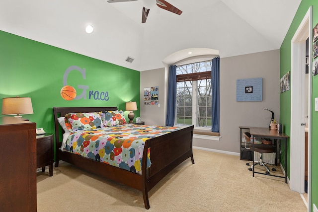 carpeted bedroom with vaulted ceiling and ceiling fan